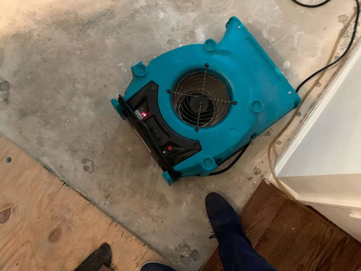 Air mover drying subfloor during Leak Detection & Repair in Ripon